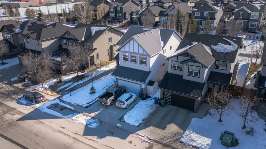 Residential driveways cleared of snow in a winter neighborhood